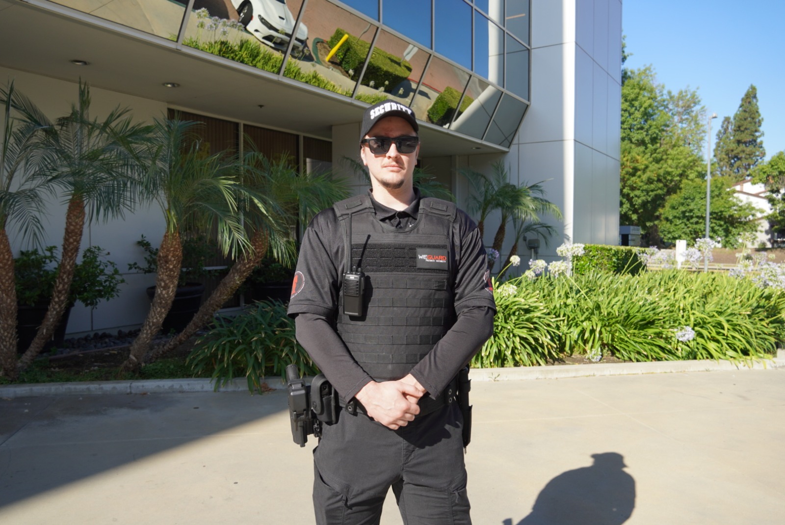 Professional security presence with cityscape at night
